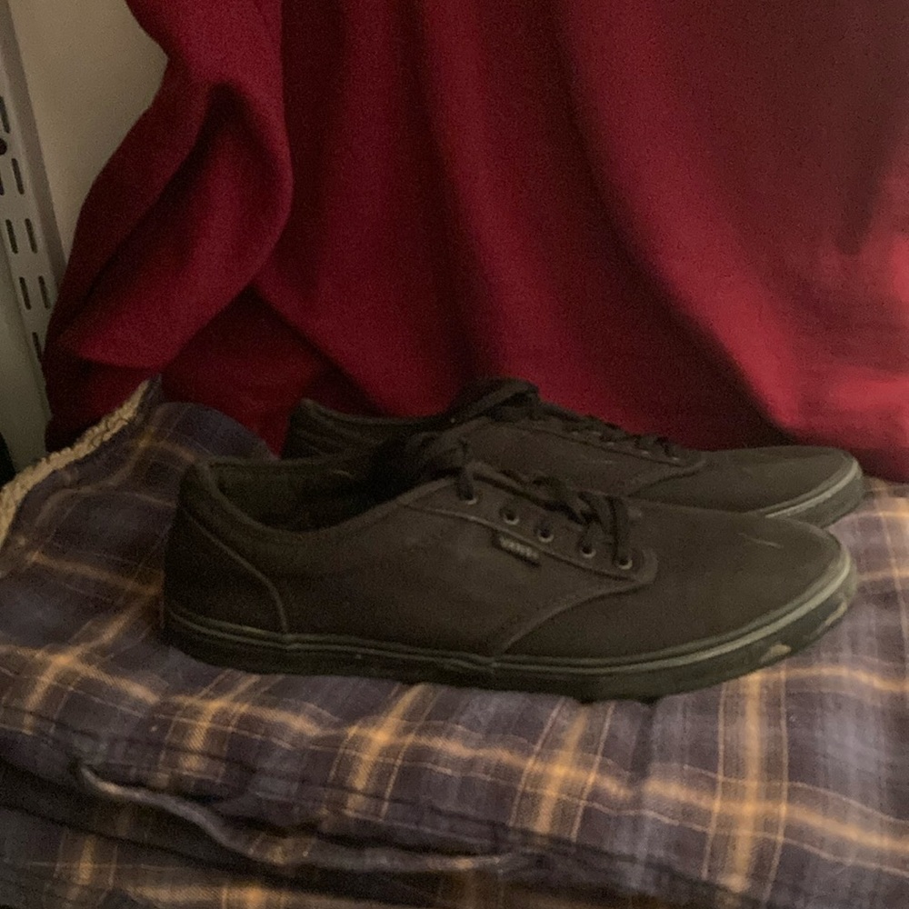 Vans black in color with black laces and soles